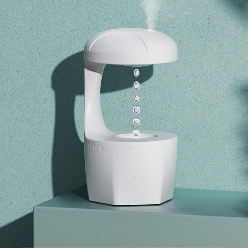 White anti-gravity humidifier with silent ultrasonic tech, minimalist design.